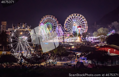 Image of Lighting Ferris wheel in the night