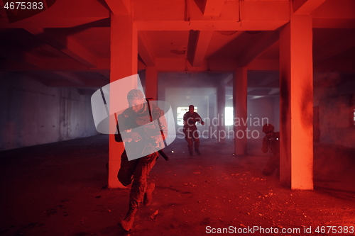 Image of military troops in action urban environment