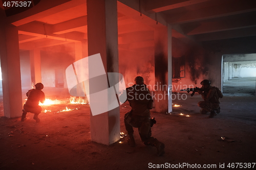 Image of military troops in action urban environment