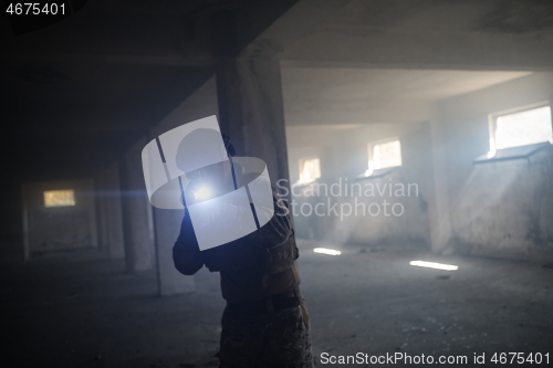 Image of modern warfare soldier in urban environment battlefield