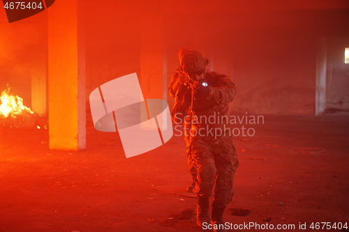 Image of military troops in action urban environment