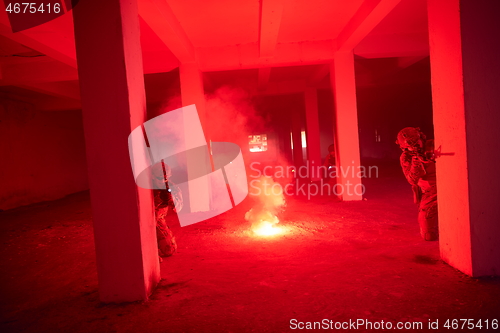 Image of military troops in action urban environment