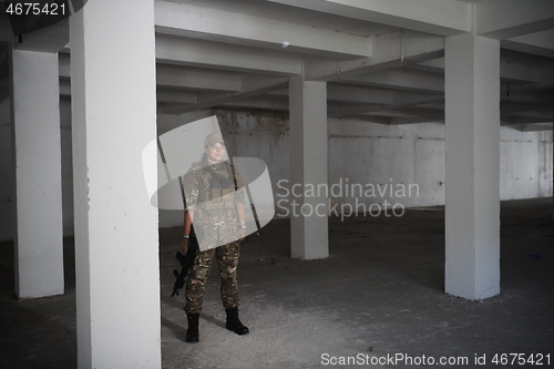 Image of military female soldier having a break