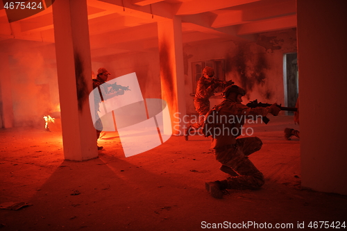 Image of military troops in action urban environment