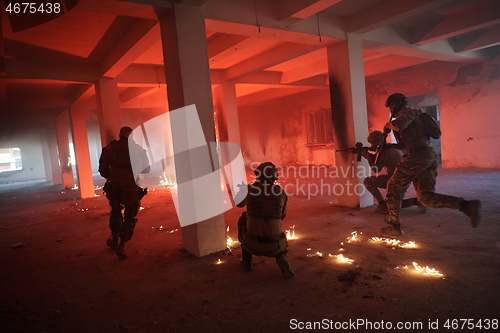 Image of military troops in action urban environment