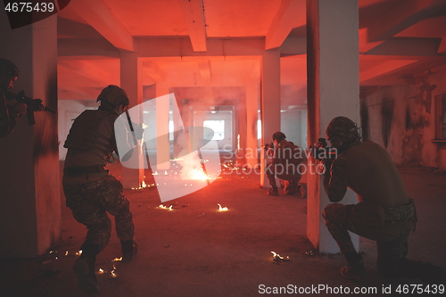 Image of military troops in action urban environment