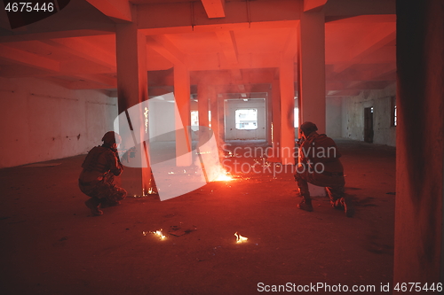 Image of military troops in action urban environment