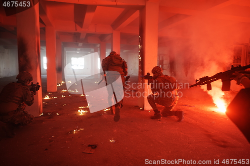 Image of military troops in action urban environment