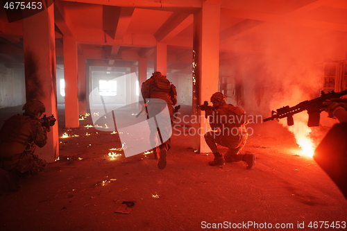 Image of military troops in action urban environment