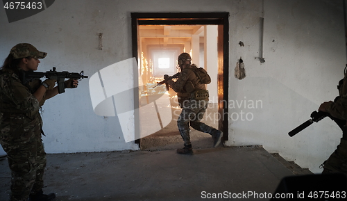 Image of military troops in action urban environment