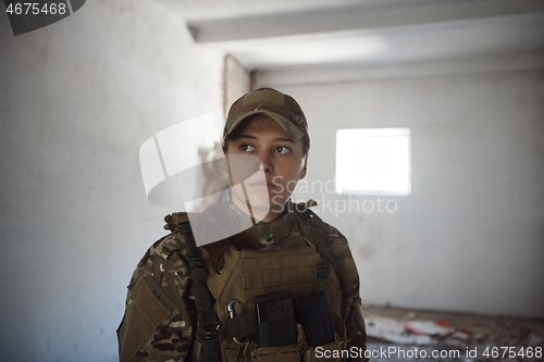 Image of military female soldier having a break