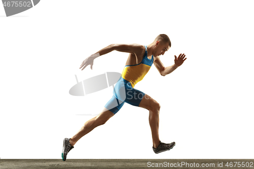 Image of Young caucasian man running or jogging isolated on white studio background.