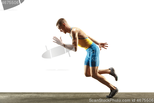 Image of Young caucasian man running or jogging isolated on white studio background.