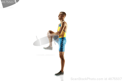 Image of Young caucasian man running or jogging isolated on white studio background.