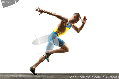 Image of Young caucasian man running or jogging isolated on white studio background.