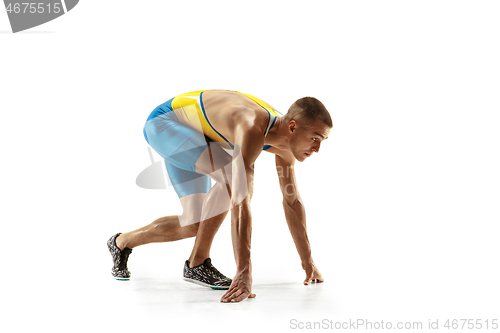 Image of Young caucasian man running or jogging isolated on white studio background.