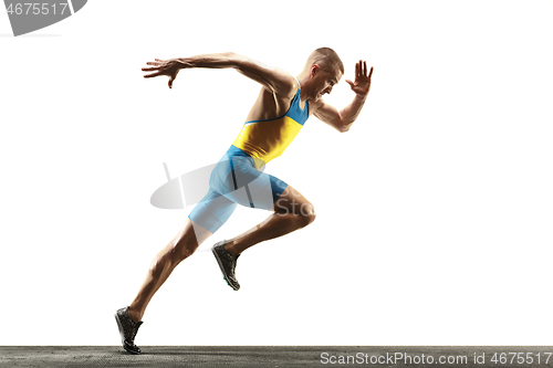 Image of Young caucasian man running or jogging isolated on white studio background.