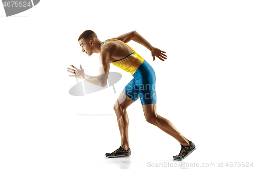 Image of Young caucasian man running or jogging isolated on white studio background.