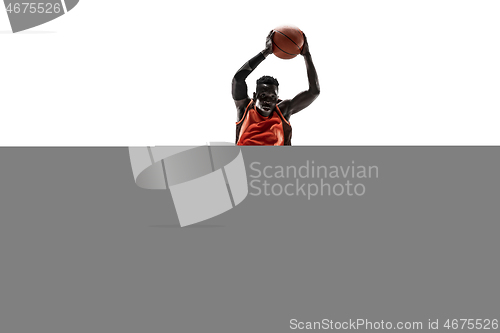 Image of Full length portrait of a basketball player with ball