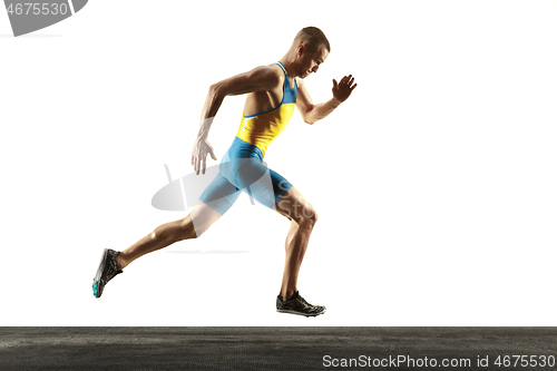 Image of Young caucasian man running or jogging isolated on white studio background.