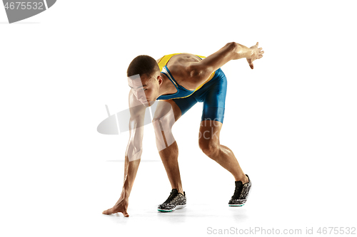 Image of Young caucasian man running or jogging isolated on white studio background.