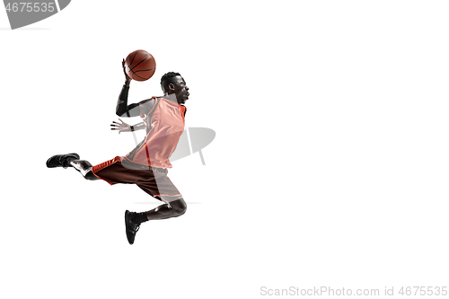 Image of Full length portrait of a basketball player with ball