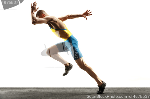 Image of Young caucasian man running or jogging isolated on white studio background.