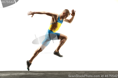 Image of Young caucasian man running or jogging isolated on white studio background.