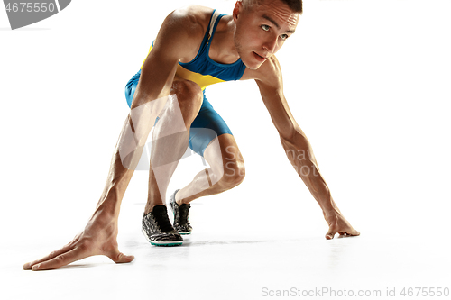 Image of Young caucasian man running or jogging isolated on white studio background.