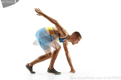 Image of Young caucasian man running or jogging isolated on white studio background.