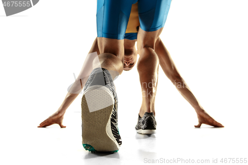 Image of Young caucasian man running or jogging isolated on white studio background.