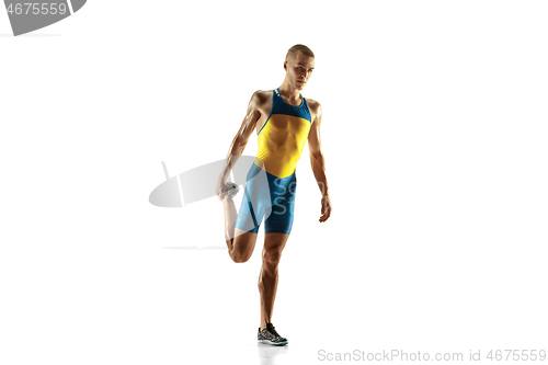 Image of Young caucasian man running or jogging isolated on white studio background.