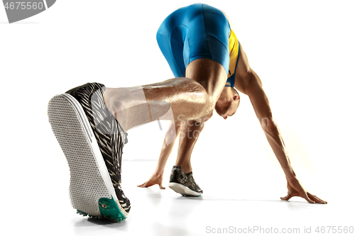 Image of Young caucasian man running or jogging isolated on white studio background.