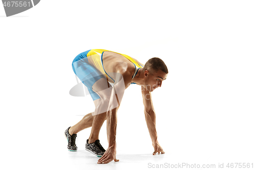 Image of Young caucasian man running or jogging isolated on white studio background.