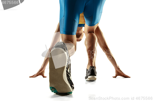 Image of Young caucasian man running or jogging isolated on white studio background.