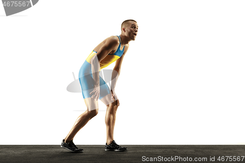 Image of Young caucasian man running or jogging isolated on white studio background.