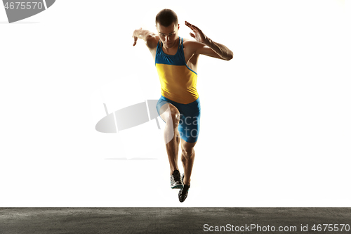 Image of Young caucasian man running or jogging isolated on white studio background.