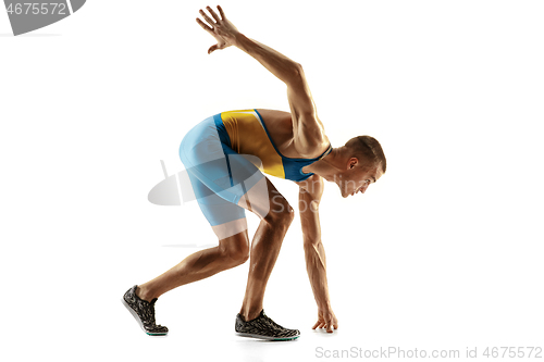 Image of Young caucasian man running or jogging isolated on white studio background.