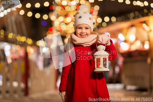 Image of happy little girl at christmas with lantern market