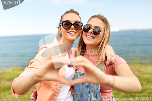 Image of teenage girls or best friends at seaside in summer