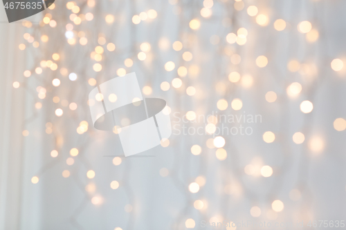 Image of christmas garland lights over grey background