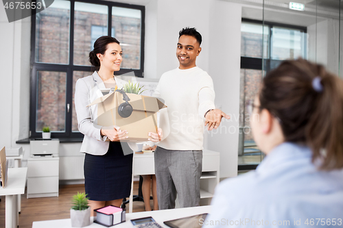 Image of new female employee meeting colleagues at office