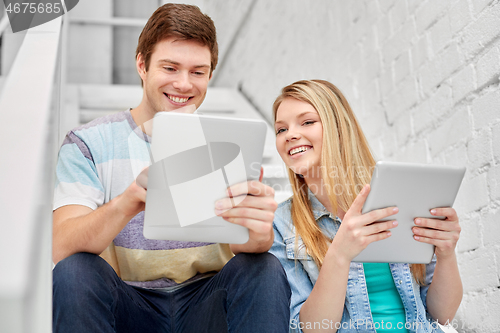 Image of high school students with tablet computers