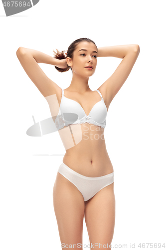 Image of Beautiful woman in underwear isolated on white background. Beauty, cosmetics, spa, depilation, diet, treatment and fitness concept, sensual posing