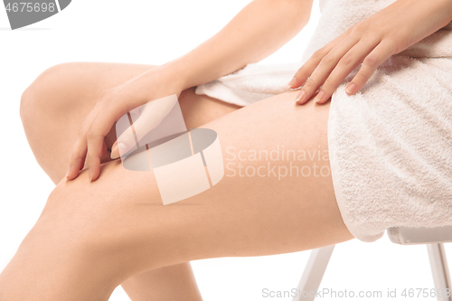 Image of Beautiful female legs isolated on white background. Beauty, cosmetics, spa, depilation, treatment and fitness concept, sensual posing