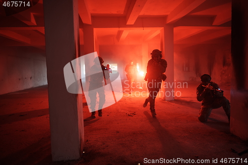 Image of military troops in action urban environment