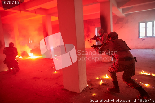 Image of military troops in action urban environment