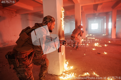 Image of military troops in action urban environment