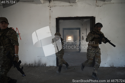 Image of military troops in action urban environment