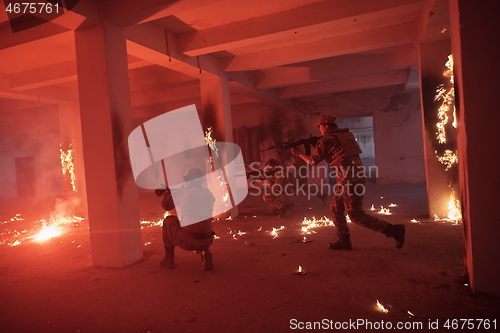 Image of military troops in action urban environment